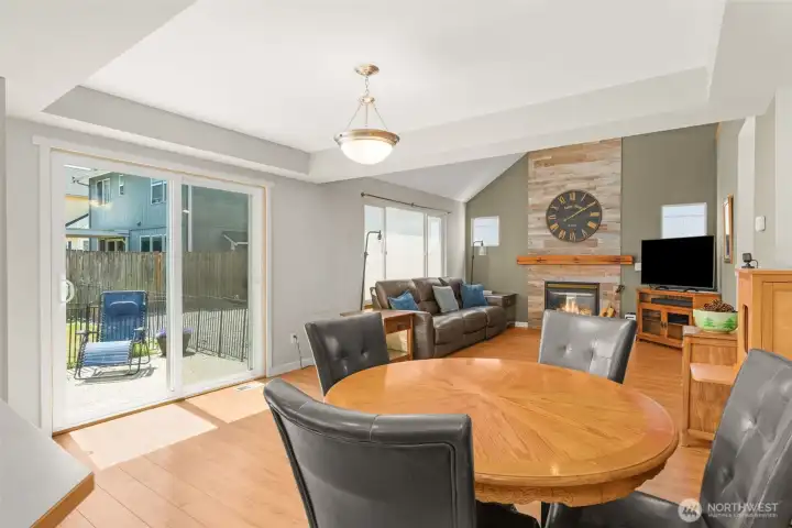 Dining area with sliding doors leading to back patio and yard