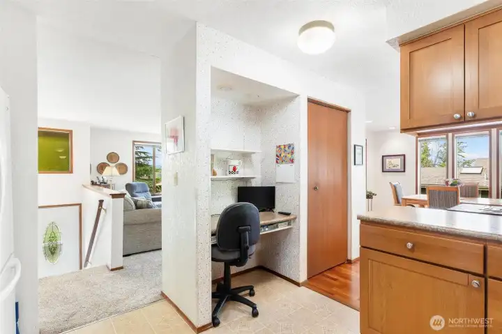 Thoughtfully designed kitchen layout featuring a convenient built-in desk nook. Thoughtfully designed kitchen layout featuring a convenient built-in desk nook.