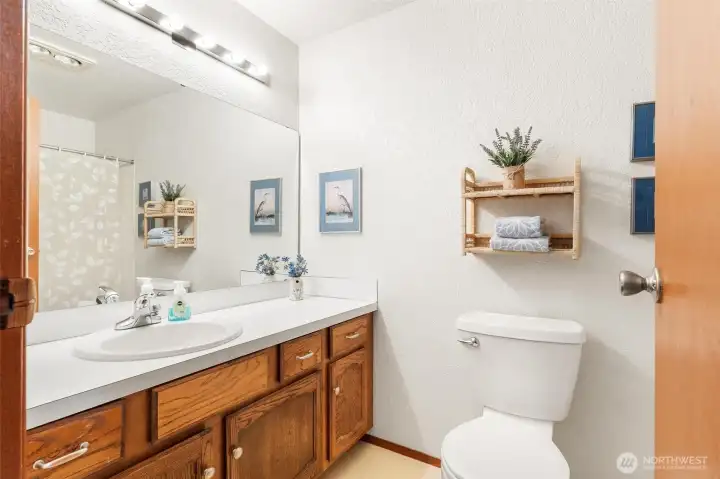 Large main bathroom featuring a wide double vanity and plenty of storage. Large main bathroom featuring a wide double vanity and plenty of storage.