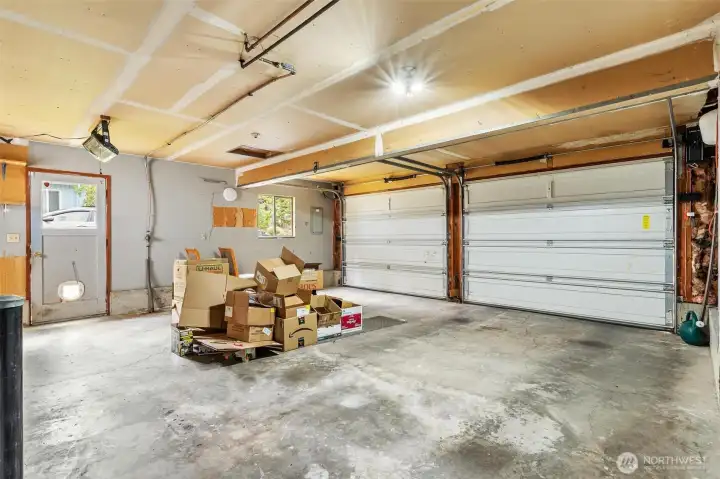 Spacious, clean two-car garage with room for projects and storage. Spacious, clean two-car garage with room for projects and storage.