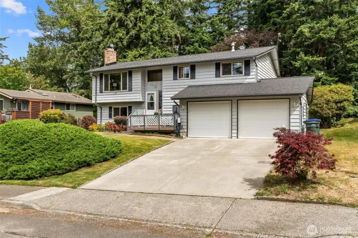 Full view of the home’s exterior and large driveway with mature trees. Full view of the home’s exterior and large driveway with mature trees.