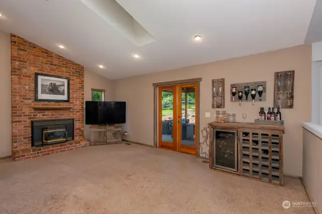 Family room with brick fireplace.