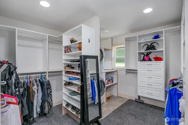 Amazing his-N-hers walk-in closet w/California closet system, and full size stack washer & dryer.