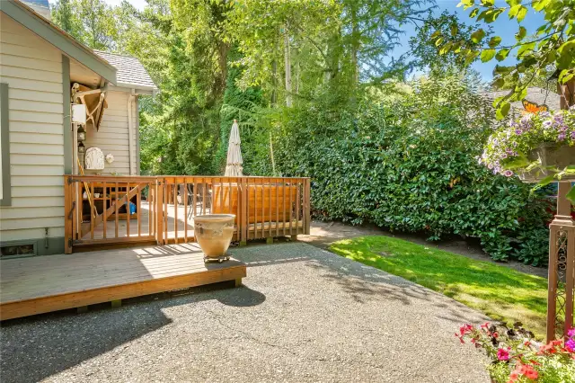 Beautiful outdoor area with private deck that wraps around and landscaped yard.