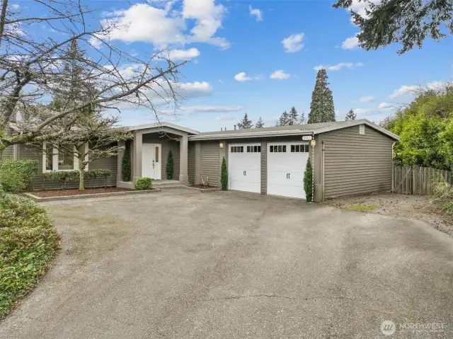 Attached two car garage entering into mudroom