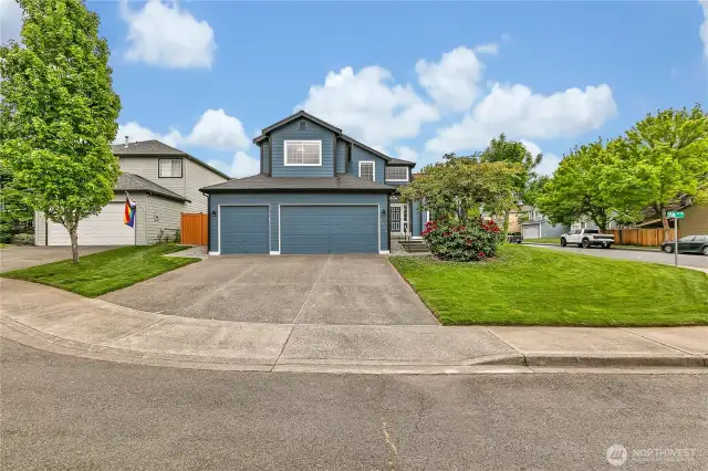 Plenty of parking with a spacious 3-car garage and an extra-wide driveway, offering convenience and ample space for multiple vehicles.