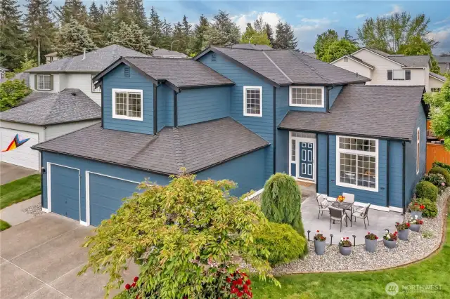 The beautifully crafted stamped concrete patio offers the perfect space to unwind in the afternoon while enjoying friendly gatherings with neighbors in a welcoming setting.