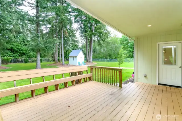 Back partially covered trex deck with access to kitchen