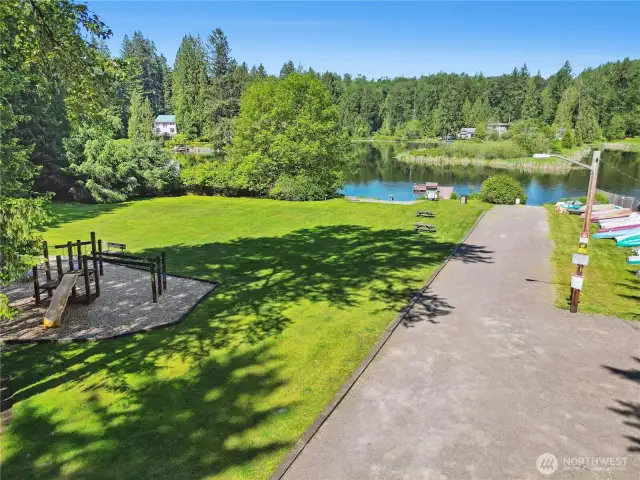 Community Beach with Playground, dock, and watercraft storage.