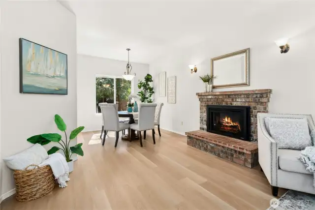 Electric gas fireplace makes this a cozy living and dining room.