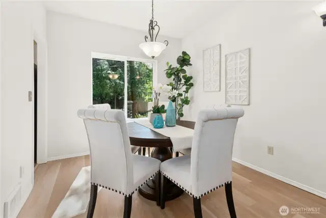 Dining area opens to formal living and kitchen.