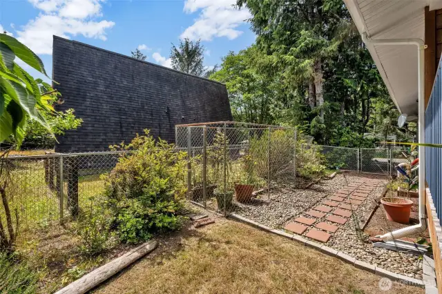 fenced garden space on the side yard