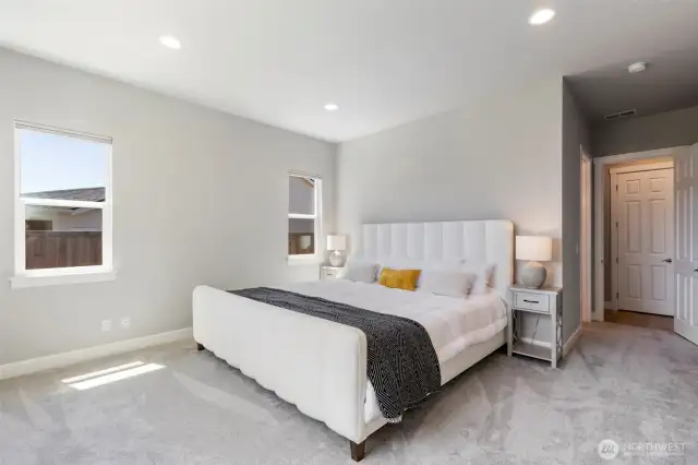 Large bedroom - this bed is an Alaskan King bed - an extra big bed, which fits graciously in this ample room