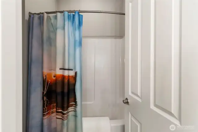 Private shower and toilet in second bathroom