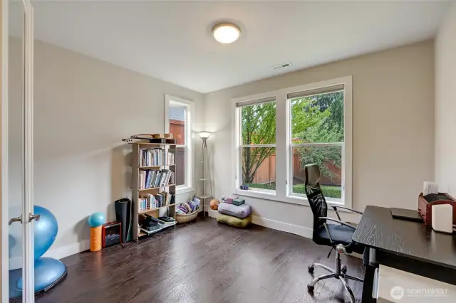 Home office with flex space located conveniently off the main entry.