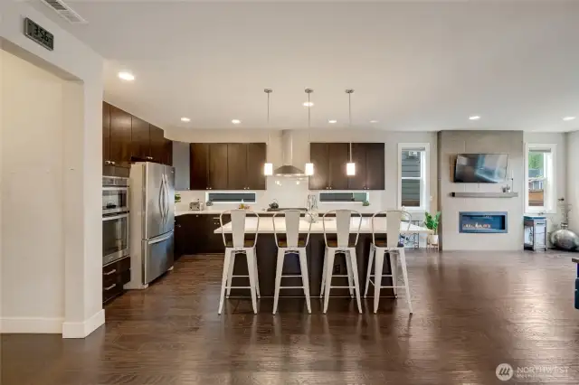 Open main level great room flows seamlessly to gourmet kitchen with center island.