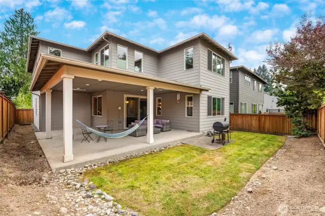 Covered wraparound patio to relax and enjoy life.