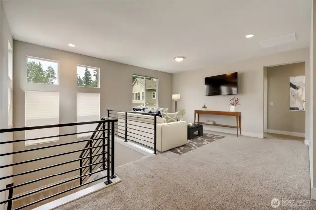 The upper level offers this expansive loft area which serves as a family room.