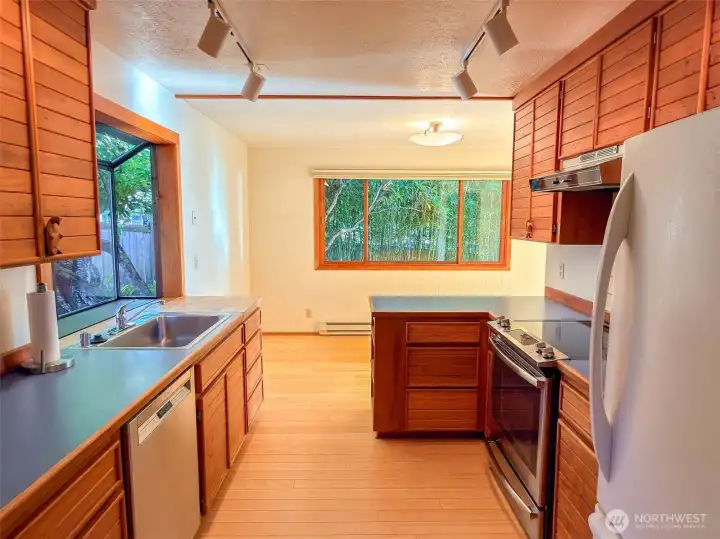 Efficient Kitchen with good counter prep areas and good storage.