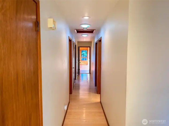 Hallway to the Bedrooms and the Sunroom at the end.