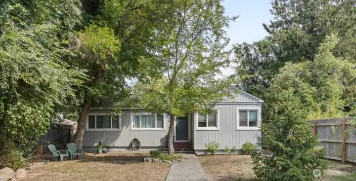 Cozy 1940s Charm in the Heart of Downtown  This well-loved home blends timeless character with thoughtful updates. Fresh paint throughout, new carpet, updated doors, and charming built-ins make it move-in ready. Bright, sun-filled rooms create a warm and welcoming feel the moment you step inside. Close to shops, restaurants and schools. Welcome Home!