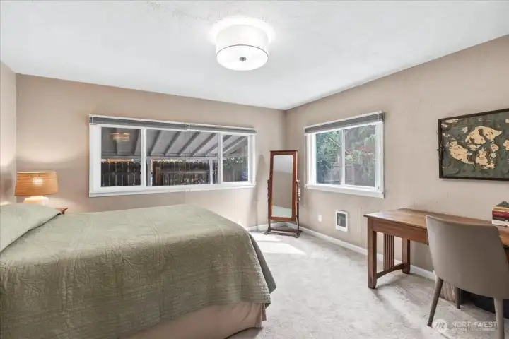 Primary Suite includes a half bath with new sliding door and storage shelf