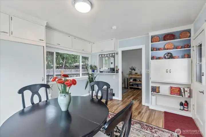 Dining area/ Laundry space.Versatile Built-ins: Extra storage and display space with classic 1940s character.