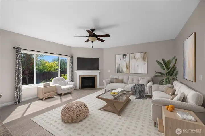Generous great room feautures new carpet, gas fireplace, and a ceiling fan offering plenty of space for entertaining. Virtually staged.