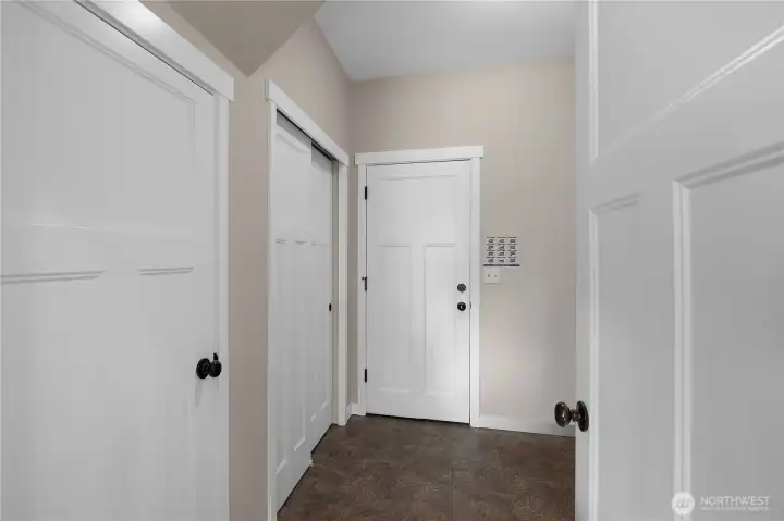 Functional utility room offers pantry and closet storage, cabinets, and counter space, add your washer and dryer.