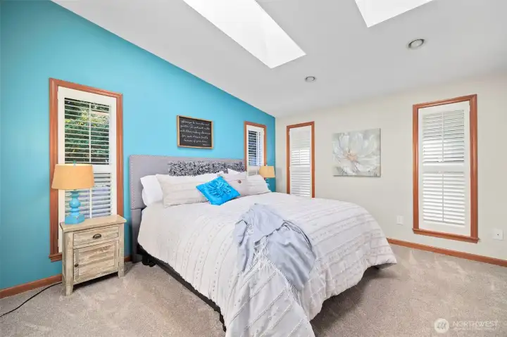Main-level primary suite offers the perfect blend of privacy and luxury