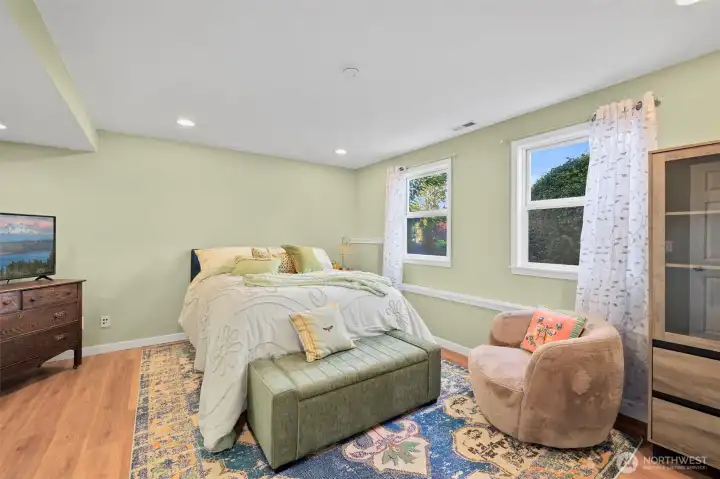 Versatile lower level perfect for guest  quarters, MIL suite, or extended family with private entrance and living space