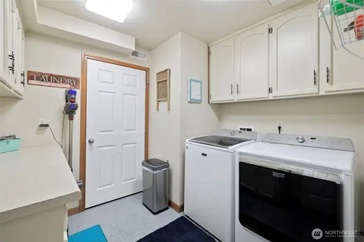 A well-designed utility space that’s perfect for laundry and extra storage
