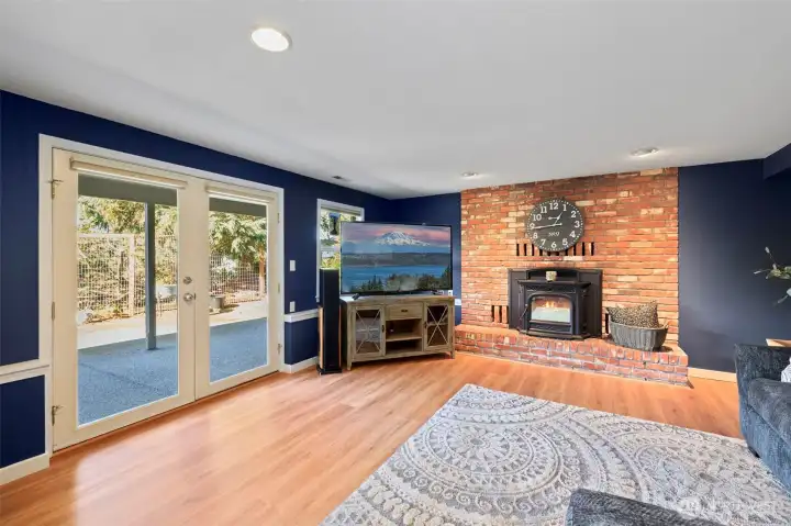 Brick surround fireplace creates a stunning accent wall full of warmth and character.