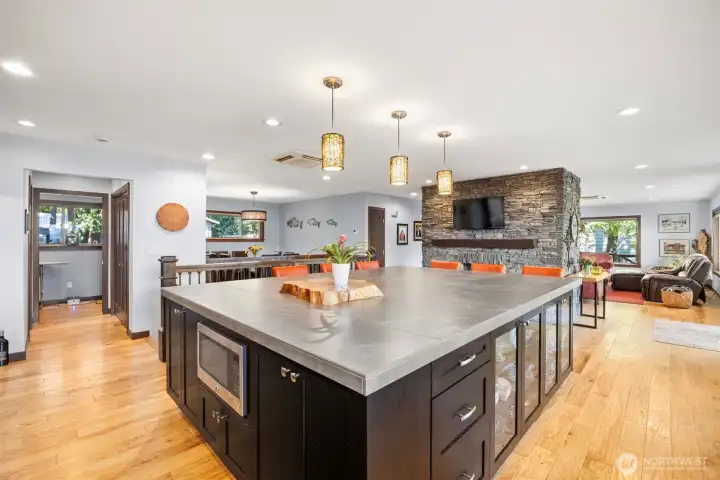 Fantastic custom island with loads of storage, refrigerator and room for 6 ! Entertaining made easy !