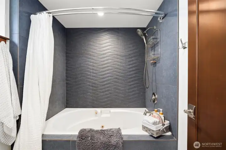 Downstairs custom tiled bath.