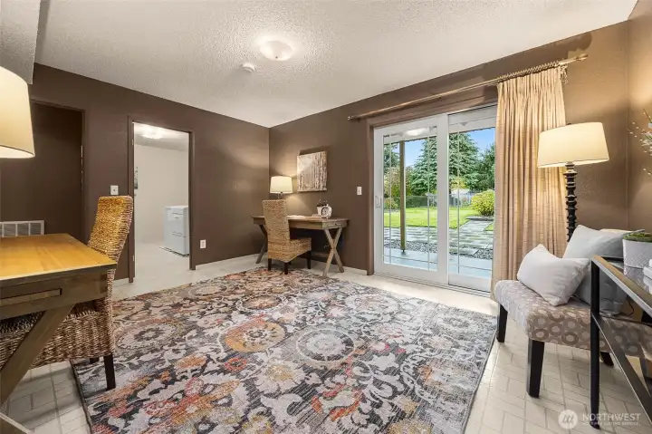 A generous lower-level flex room offers versatility for modern living—ideal as a private office, guest suite, or additional bedroom.