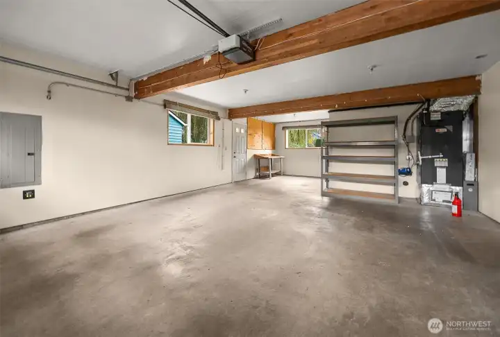A substantial garage with workshop space provides the perfect blend of practicality and versatility.