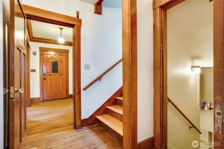 Let's head upstairs! The risers and steps were also recently refinished- It is so easy to move into this home! The door to the right heads down to the basement.