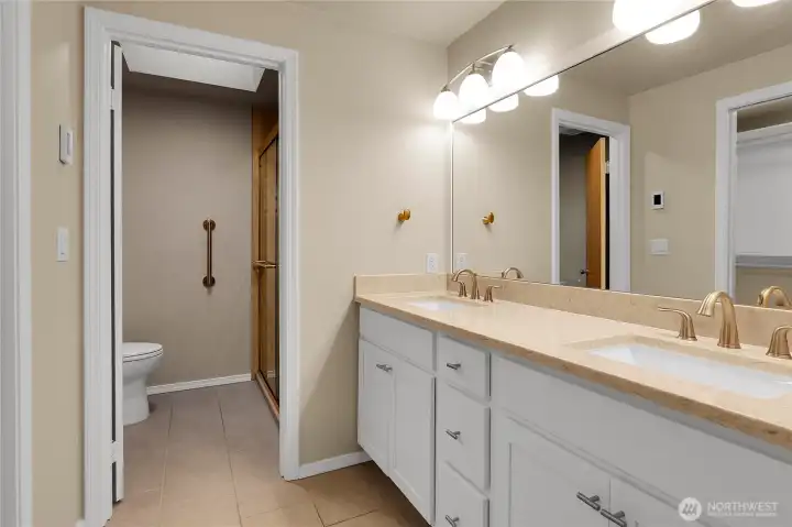 3/4 en-suite bathroom off primary with heated floors and walk in closet