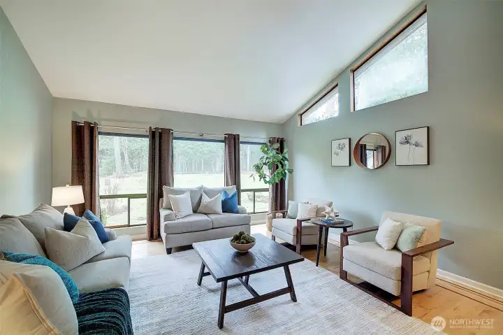 The light-filled living room with vaulted ceilings creates a stunning gathering space.