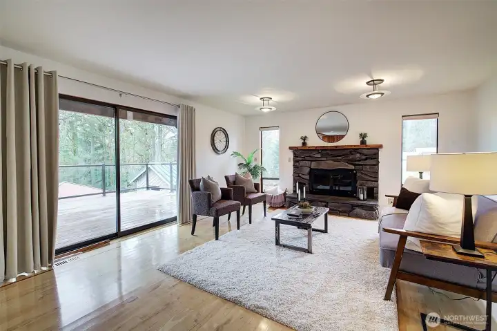 You'll love this wide sliding door with access to an expansive sundeck—ideal for outdoor dining, entertaining, or simply enjoying the tranquil setting.