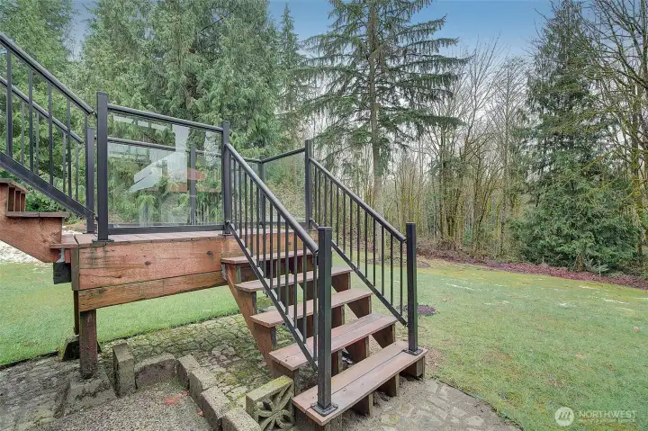 Stairs are finished custom materials to match the decking with medal handrails.