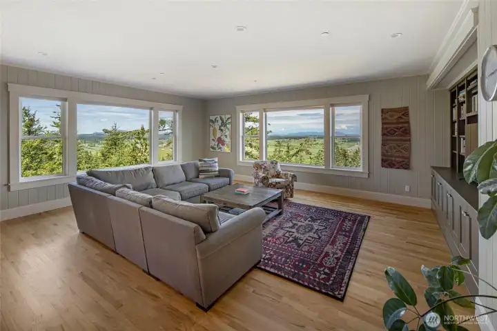 Light-filled main living area with panoramic windows, creating a seamless connection to the surrounding San Juan Island landscape.