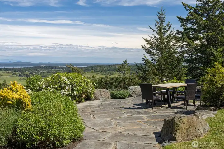Private stone patio with stunning panoramic views—ideal for outdoor dining, entertaining, or enjoying peaceful island sunsets.