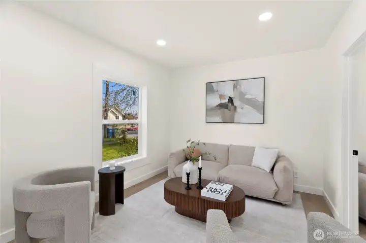 Comfortable living space with large window and modern finishes.