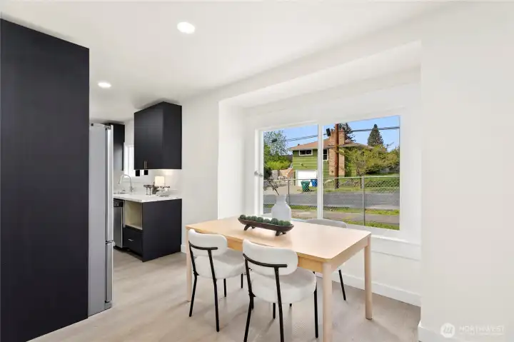 Open dining space with natural light and seamless flow from kitchen.