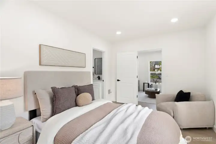 Spacious primary bedroom with modern finishes.