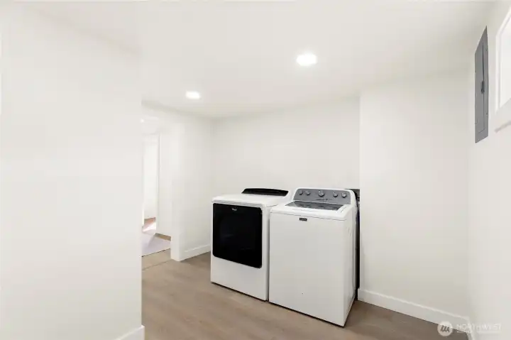 Dedicated laundry space with newer appliances.