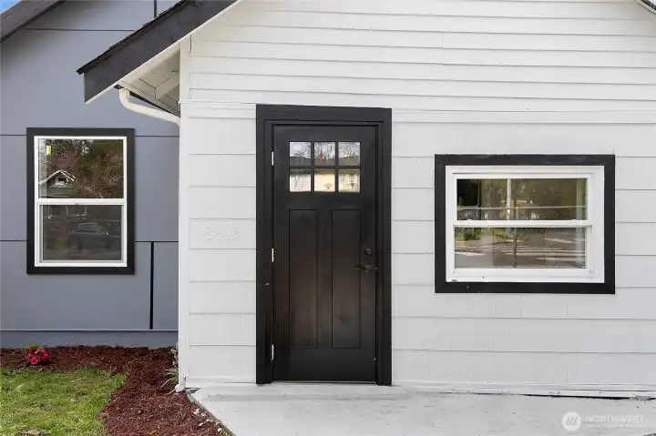 Updated front entry with modern door and trim.