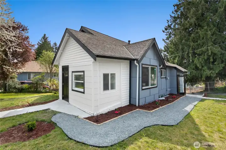 Fully remodeled home with modern exterior and fresh landscaping